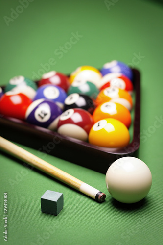 Billiard balls, cue on green table!