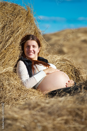 pregnant woman on hay