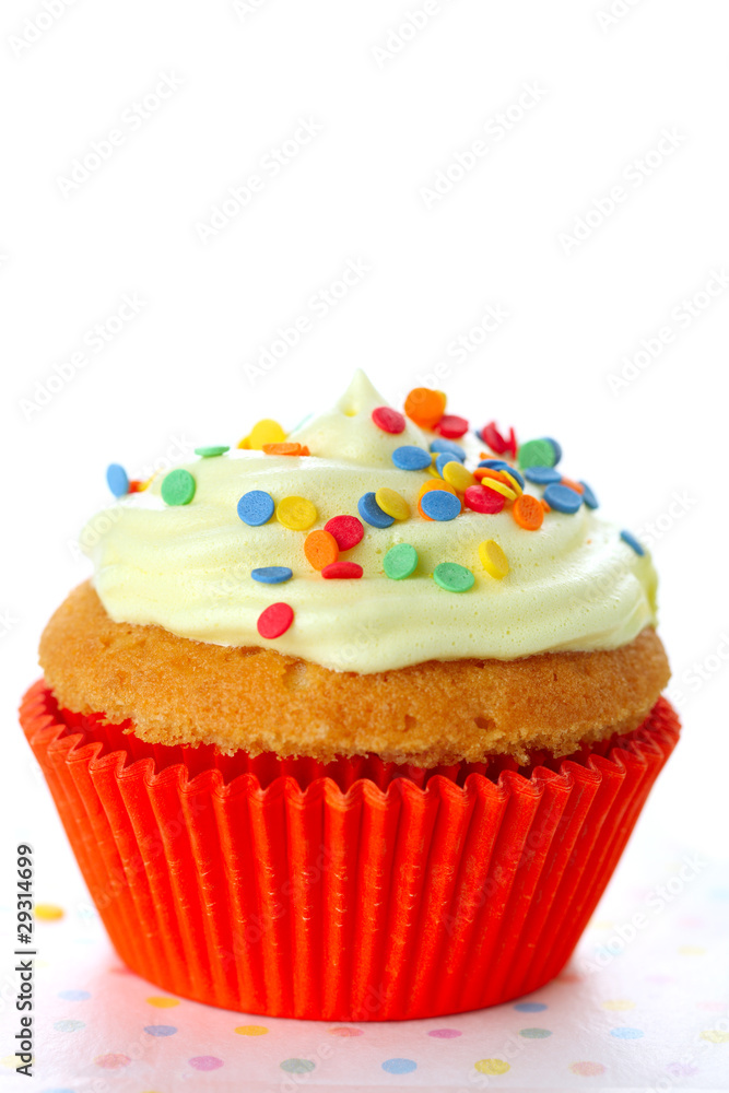 Cupcake decorated with sugar sprinkles  on white isolated backgr