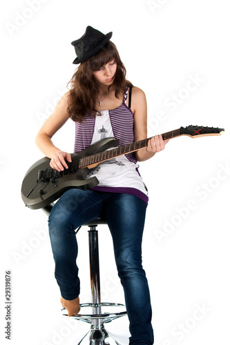 Beautiful girl playing the guitar photo