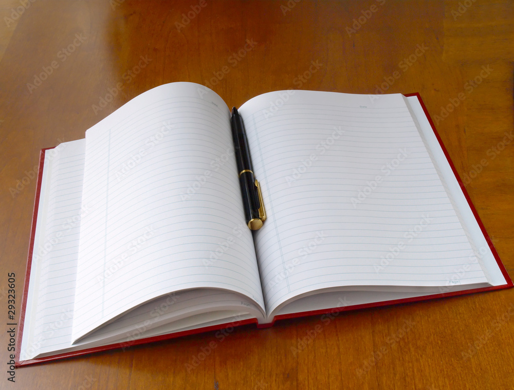 Planner with pen on the table Planner with pen on the table