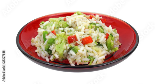 Vegetable rice on red plate