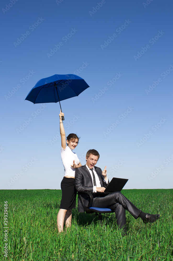 Happy businessmen working on laptop. Outdoors on a sunny day Happy businessmen working on laptop. Outdoors on a sunny day