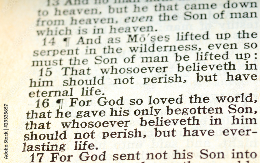 An old King James Version Bible open to John 3:16