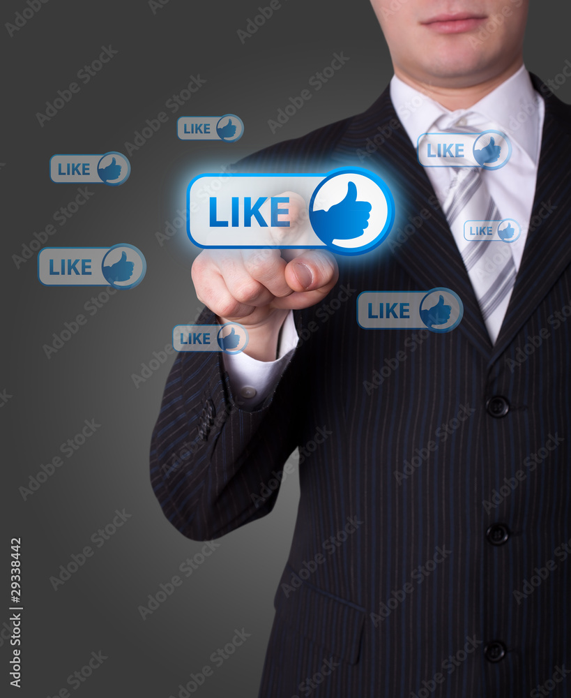 Man pressing social network button Man pressing social network button