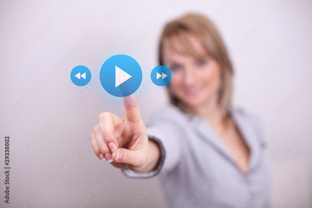 Woman pressing play and media button Woman pressing play and media button