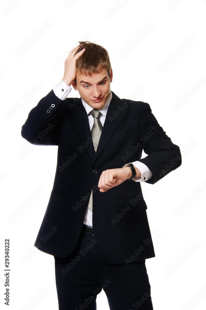 Confused businessman looking at watch Confused businessman looking at watch