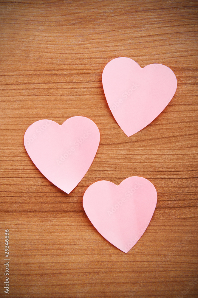 Heart shaped sticky notes on the background Heart shaped sticky notes on the background