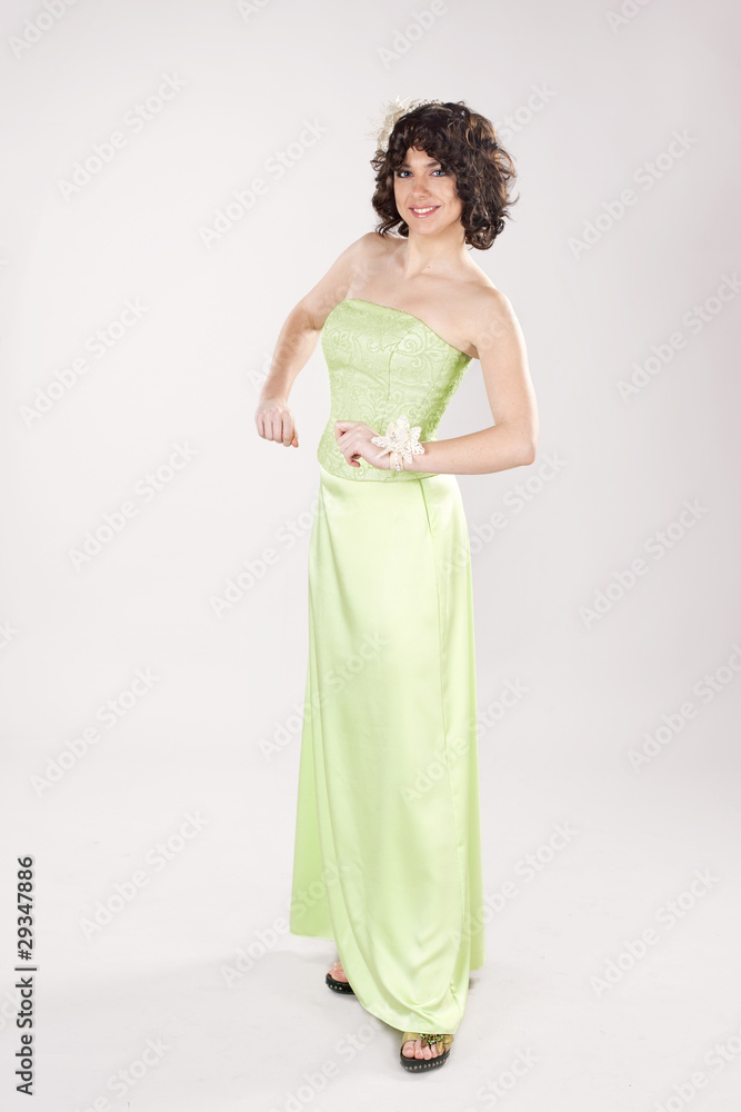 Yound smiling girl in long green dress Yound smiling girl in long green dress