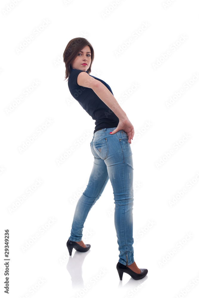 Girl in jeans posing in studio Girl in jeans posing in studio