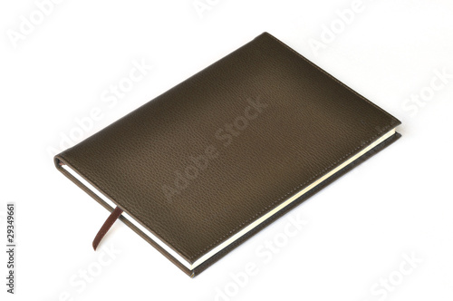 Dark brown leather notebook on white background