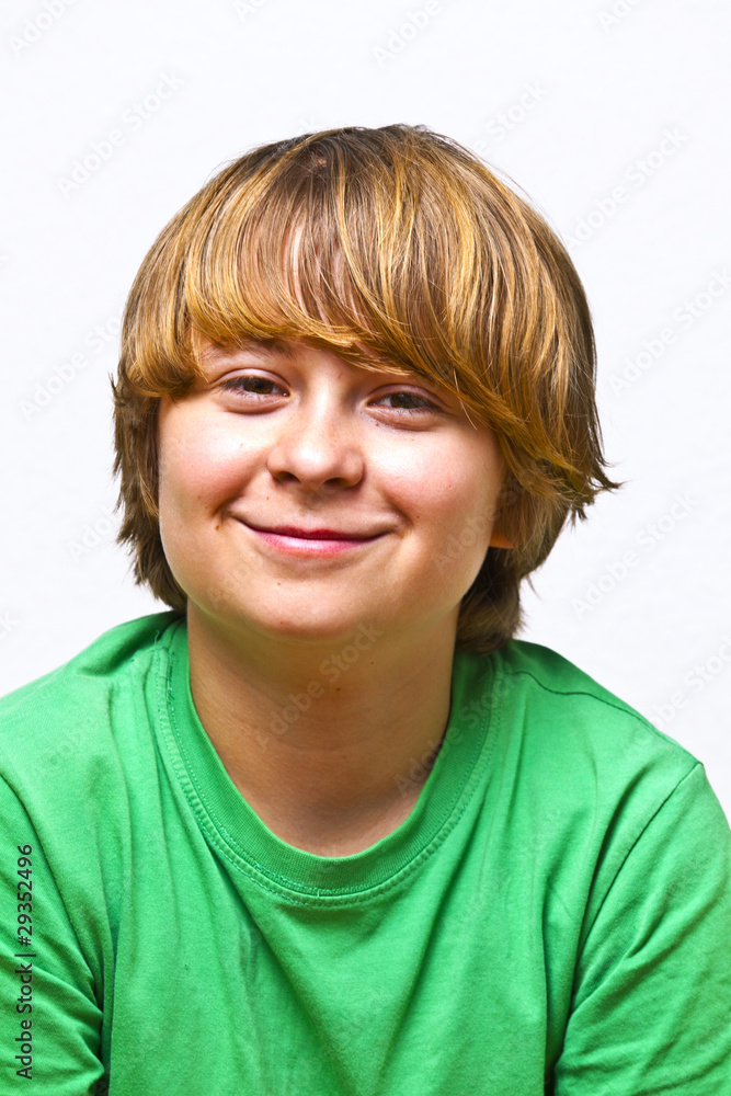 smiling boy sitting on a sofa smiling boy sitting on a sofa