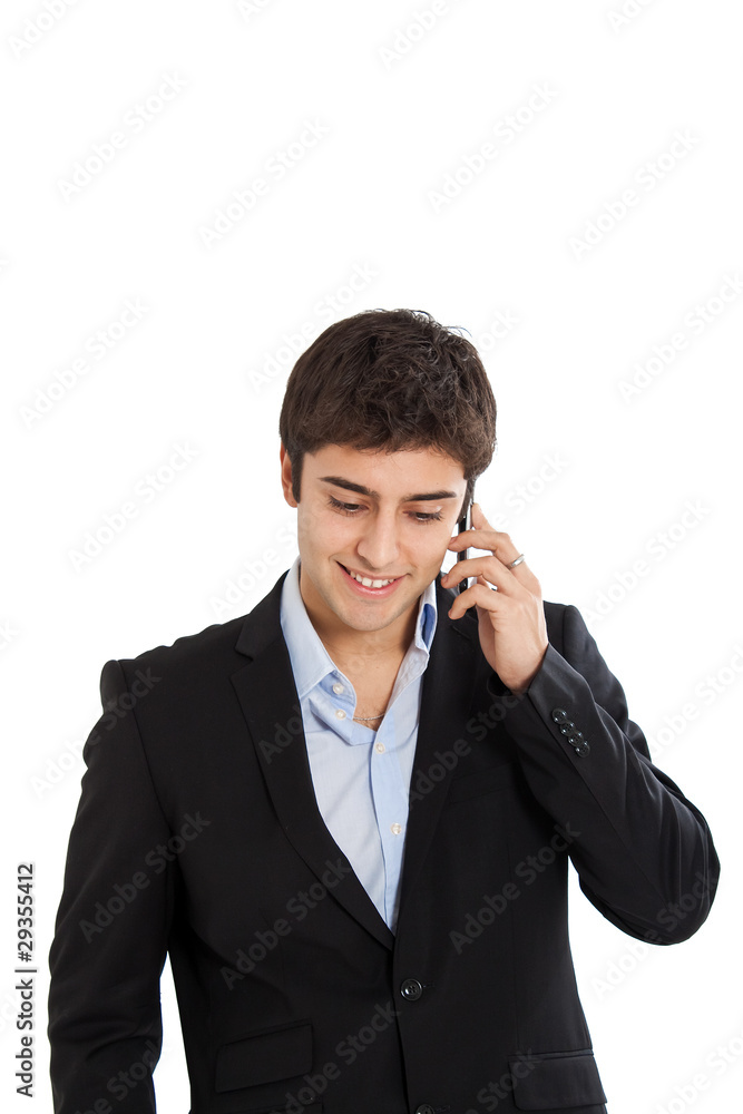 Young businessman talking at the phone isolated on white Young businessman talking at the phone isolated on white