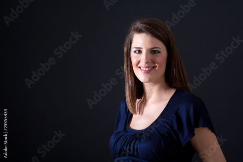 Beautiful attractive woman portrait on black background