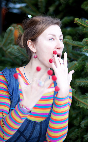 Beautiful young girl in bright clothes poses as Amelie with rasp photo