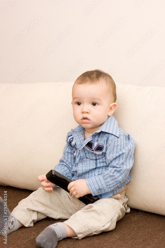 Cute caucasian boy with tv console Cute caucasian boy with tv console