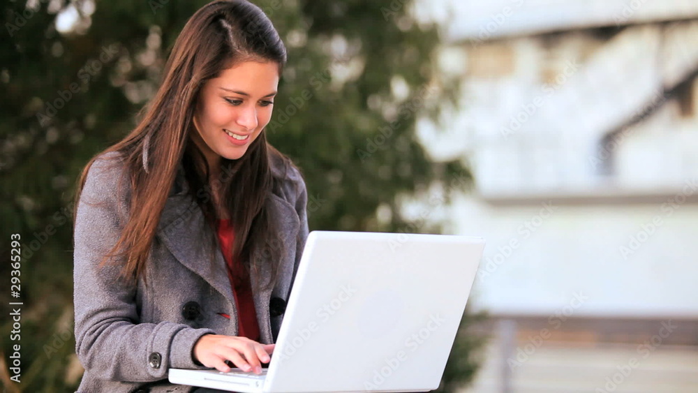 Pretty Young Student Using Laptop Outdoors Pretty Young Student Using Laptop Outdoors