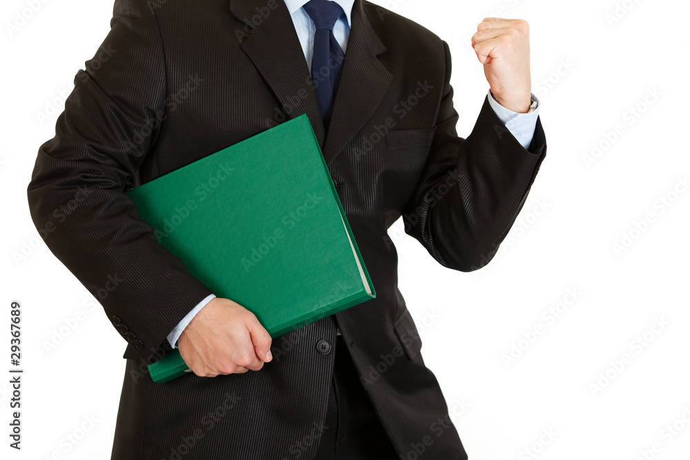 Pleased modern businessman holding folder. Close-up. Pleased modern businessman holding folder. Close-up.