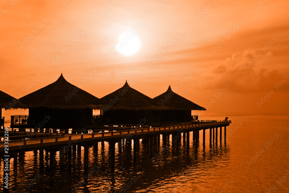 Water bungalows and sunset