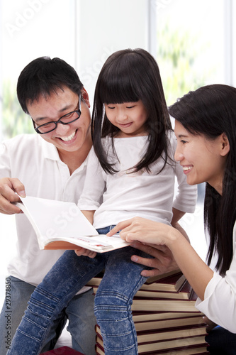 Happy asian family studying together photo