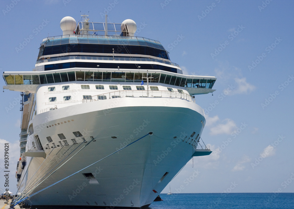 Cruise Ship Tied to Dock with Blue and White Ropes Cruise Ship Tied to Dock with Blue and White Ropes