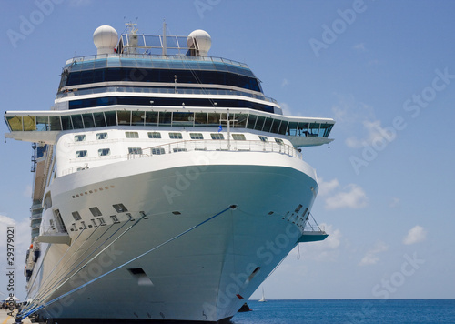 Cruise Ship Tied to Dock with Blue and White Ropes