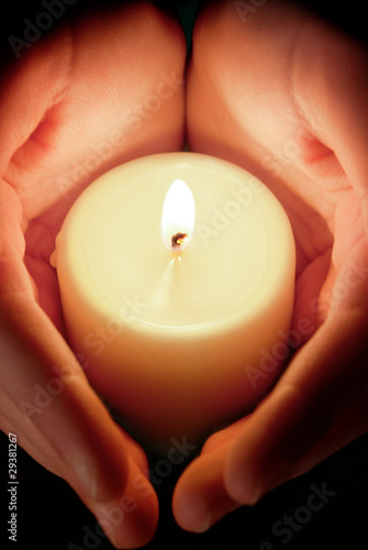 candle between the hands