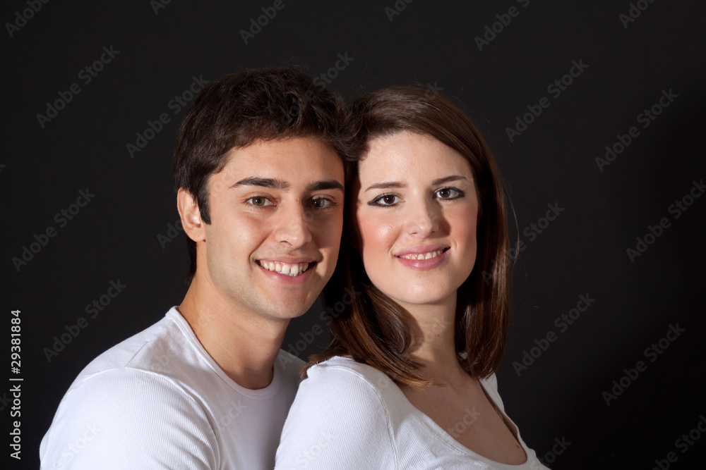 Young loving couple isolated on black background Young loving couple isolated on black background
