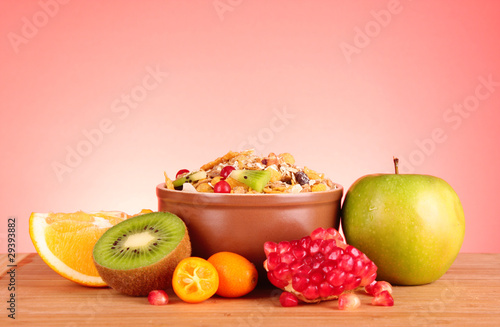 Fototapeta Naklejka Na Ścianę i Meble -  muesli and fruits on red background