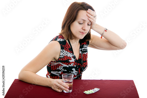 Young girl with green pills photo