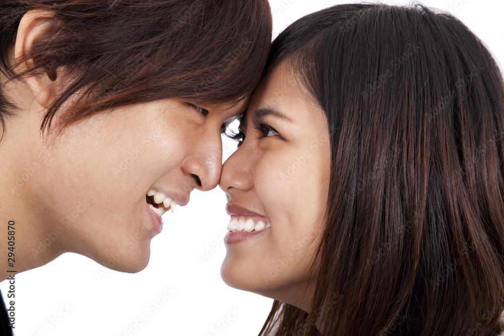 Young asian couple face to face and smiling Young asian couple face to face and smiling