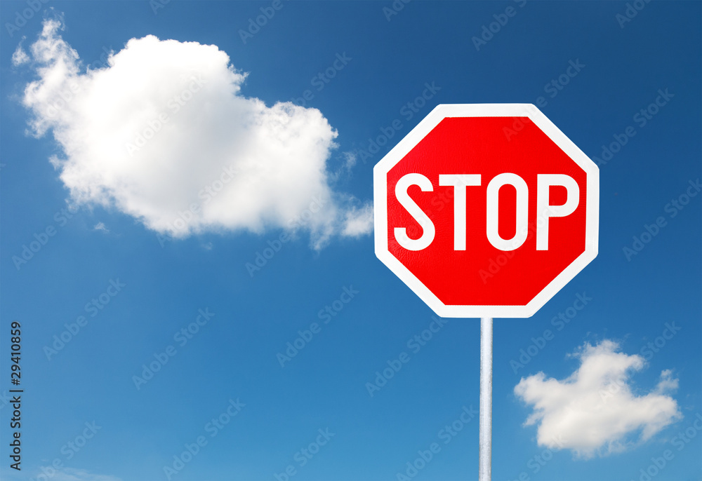 Stop sign for traffic against blue sky Stop sign for traffic against blue sky