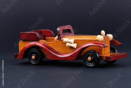 A toy car made of wood