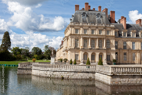 Medieval royal castle Fontainbleau and lake near Paris in France