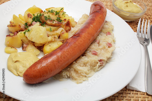 Krakauer Bratwurst, Sauerkraut, Bratkartoffeln photo