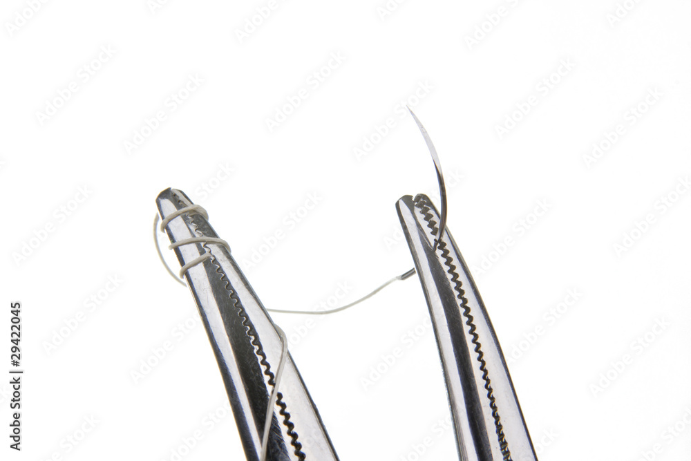 Obraz premium Forceps holding suture