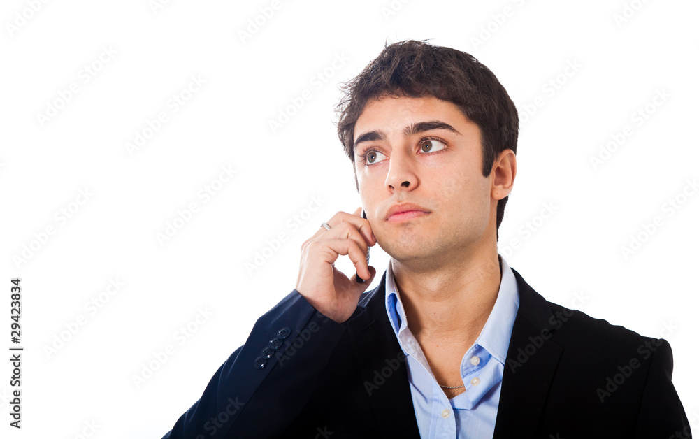 Thoughtful young businessman isolated on white