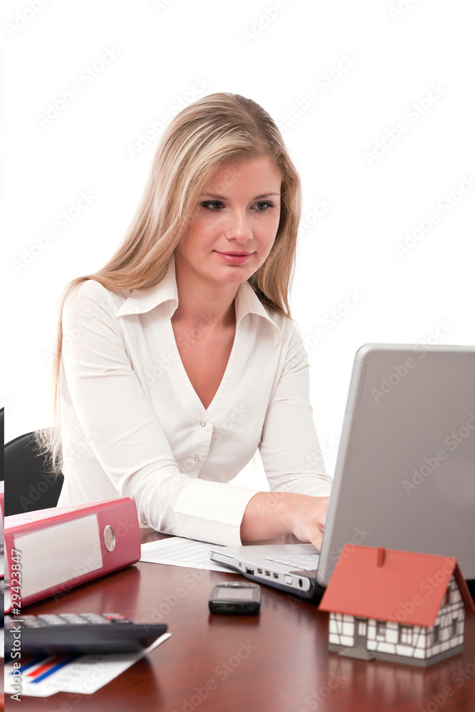 Real estate executive working on laptop Real estate executive working on laptop