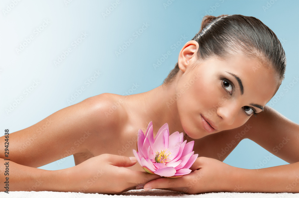 Beauty with lotus flower at spa Beauty with lotus flower at spa