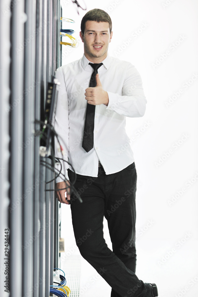 young it engeneer in datacenter server room young it engeneer in datacenter server room