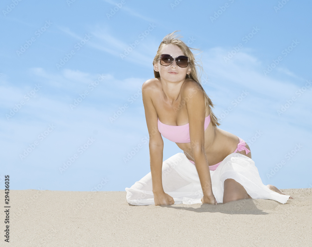 Woman posing on the beach with white silk scarf Woman posing on the beach with white silk scarf