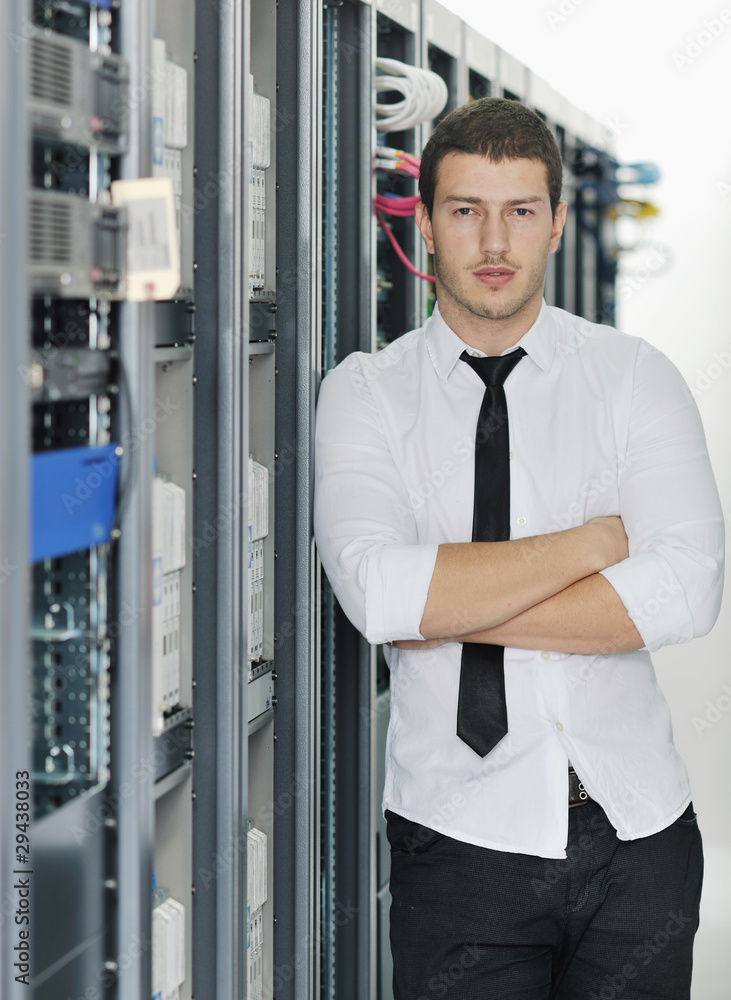 young it engeneer in datacenter server room young it engeneer in datacenter server room