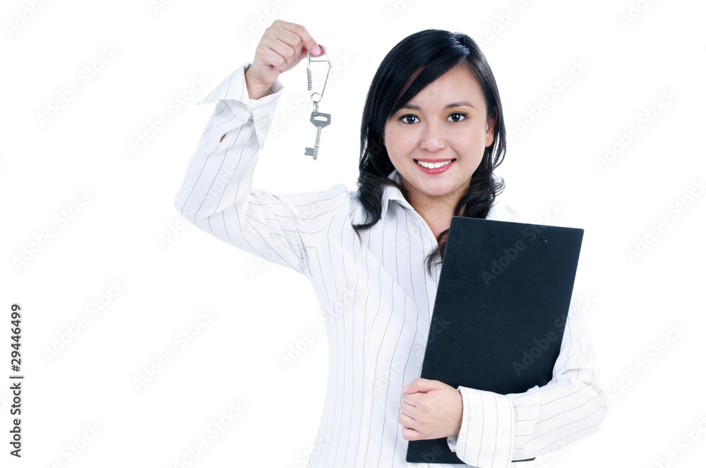 Happy young businesswoman holding key and clipboard Happy young businesswoman holding key and clipboard
