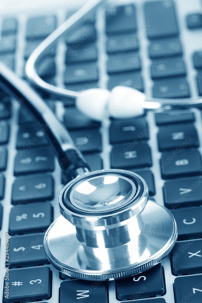 stethoscope on computer keyboard stethoscope on computer keyboard