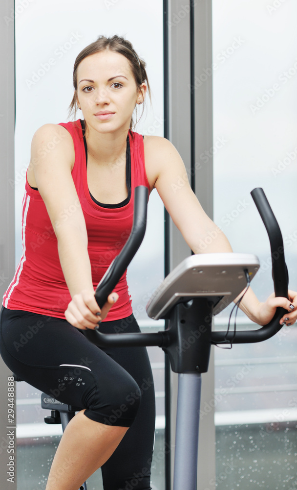 woman workout in fitness club on running track woman workout in fitness club on running track
