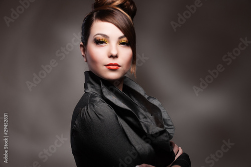 alluring young woman over dark background