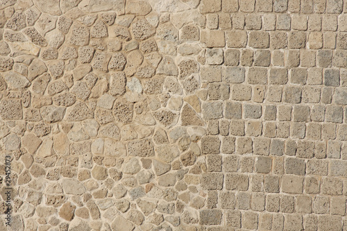 Two different patterns in wall of limestone and coral blocks photo