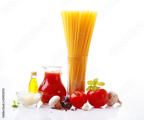 Composition of pasta, tomato, cheese, olive and garlic