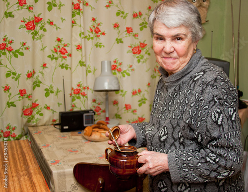 an elderly grey woman on a kitchen