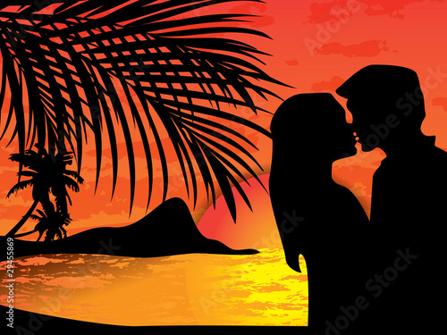 Two lovers on the beach with tropical sunset behind them